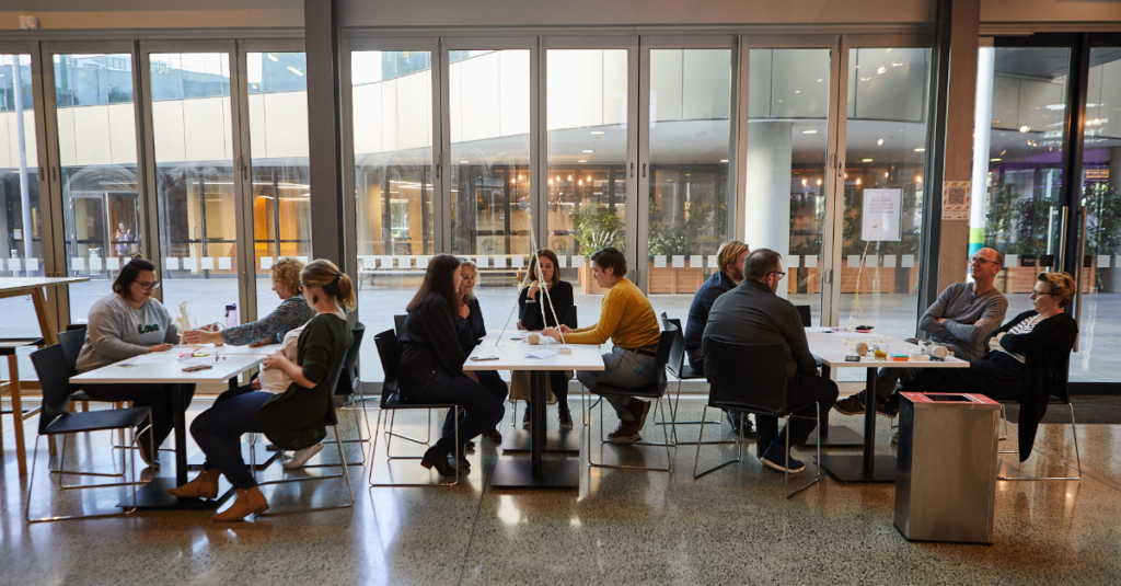 Small group discussions during a Ways of Working team coaching workshop in Auckland, Aotearoa NZ