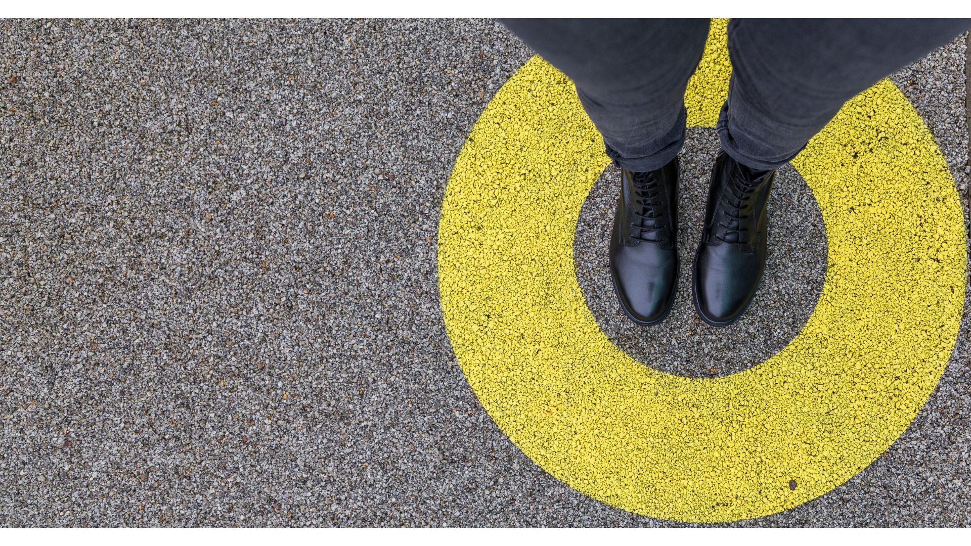 Person standing in a yellow circle